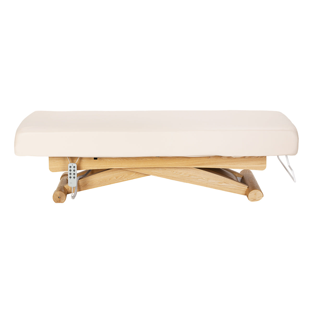 Cream Sillon Siesta spa lounger with light brown base, used as beauty salon furniture for comfortable relaxation.