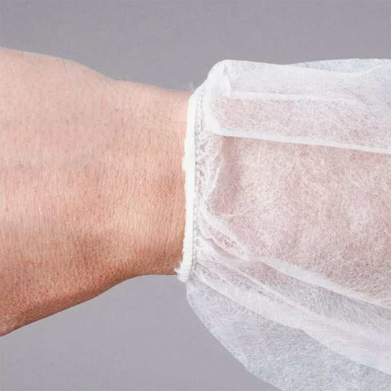 UnigloVes XXL disposable dressing gown with Velcro strip, lightweight and breathable for medical or spa use.