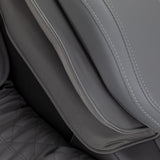 Sakura Maximus 3D Sakura massage chair in white and grey with ergonomic design and padded armrests for relaxation.