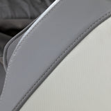White and grey Sakura 3D Maximus massage chair showing plush upholstery and ergonomic design for relaxing massage therapy.