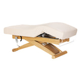 Cream-colored SPA lounger Sillon Siesta with light brown base, ideal for beauty salon furniture, comfortable and stylish.