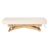 Cream Sillon Siesta spa lounger with light brown base, used as beauty salon furniture for comfortable relaxation.