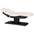Cream SPA lounger Sillon Relax with black base, used as beauty salon furniture for comfortable client relaxation.