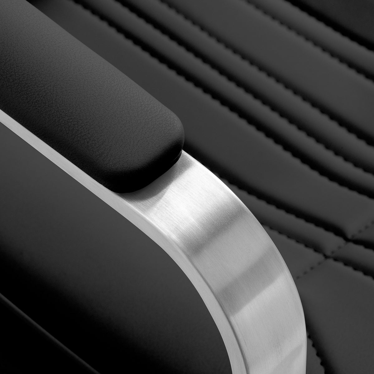 Black Gabbiano Acri hairdressing chair with cushioned seat, adjustable height, and modern design for salon styling.