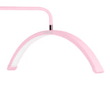 MOMO MX6 pink floor lamp positioned beside a professional beauty bed