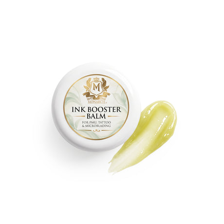 Skin Monarch Ink Booster Balm 30ml, couvercle à côté d'une trace de baume jaune brillant