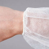 UnigloVes XXL disposable dressing gown with Velcro strip, lightweight and breathable for medical or spa use.