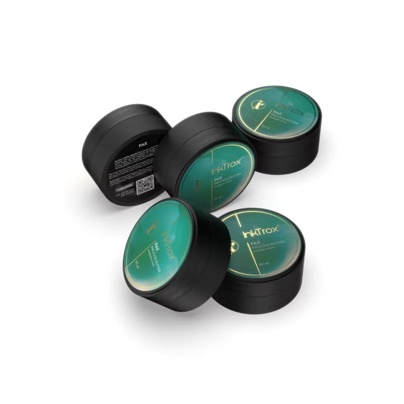 Several InkTrox PAX tattoo butter jars