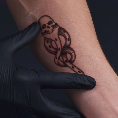 Tattoo Eazer Second Skin Protective Film in 12x18cm sheets, 50-pack, used for protecting fresh tattoos during healing process.
